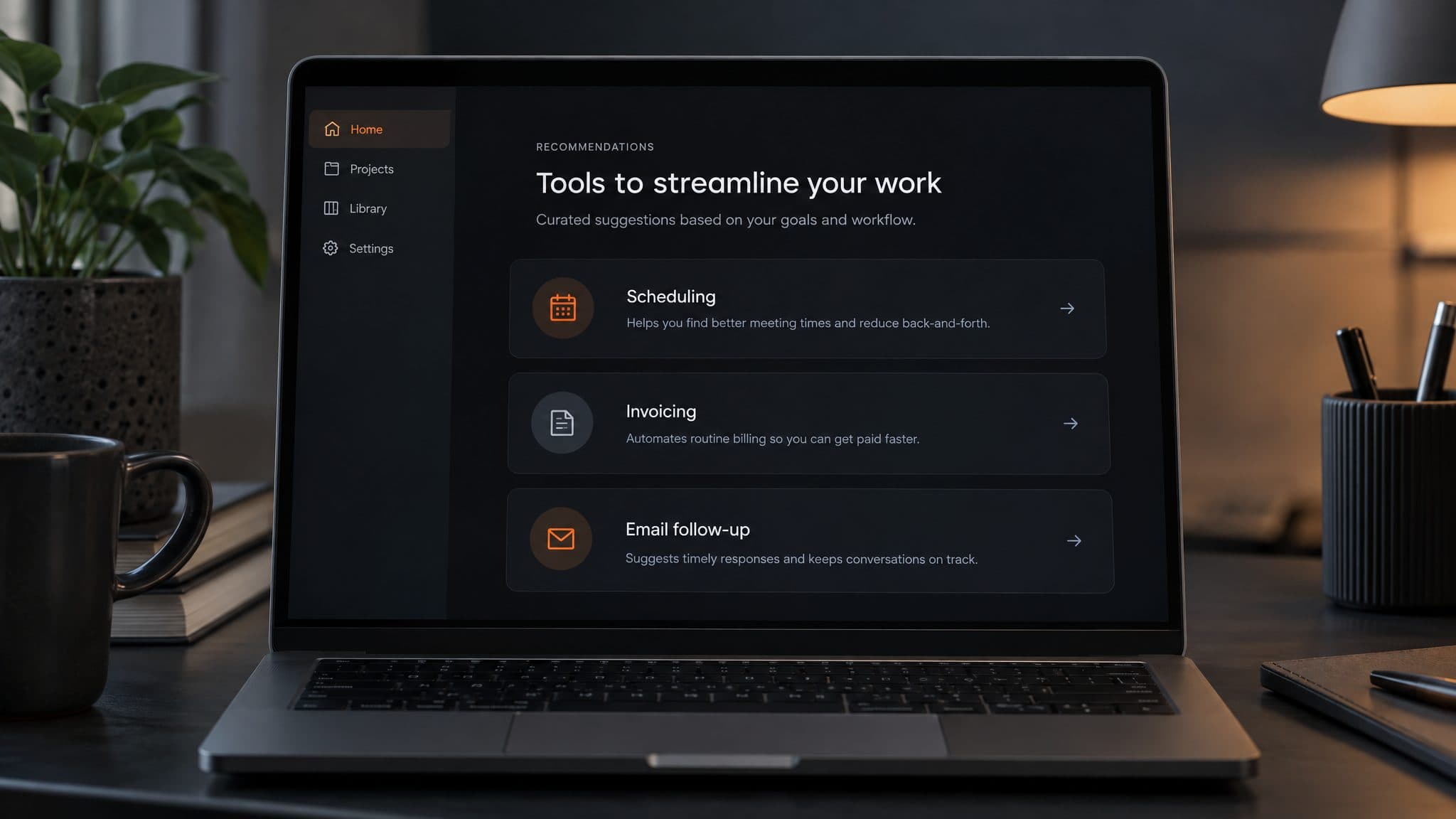 Laptop showing three AI tool recommendations, each with a short reason